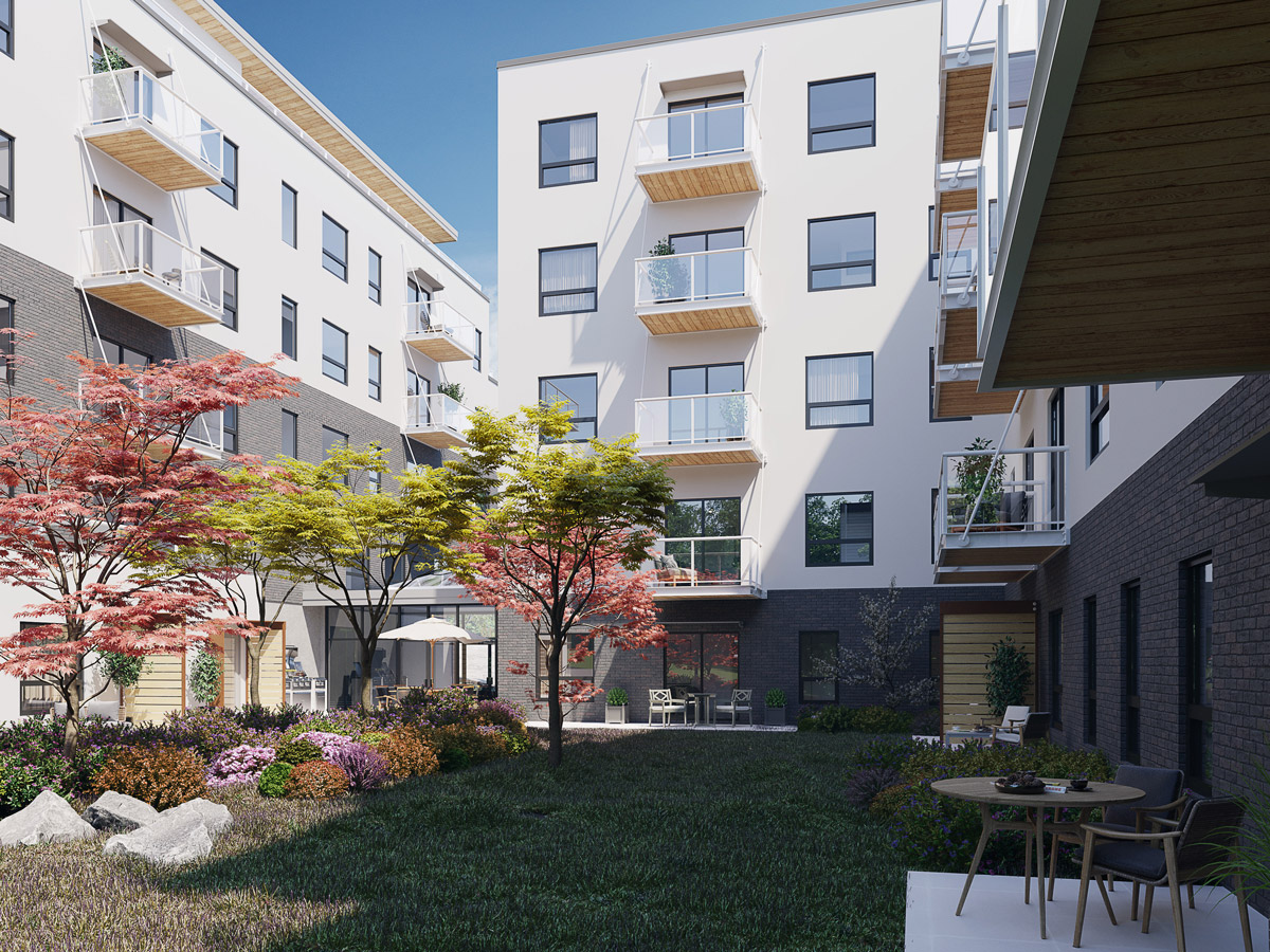 The Proxima in Esquimalt BC features a verdant courtyard with plants, grass and trees