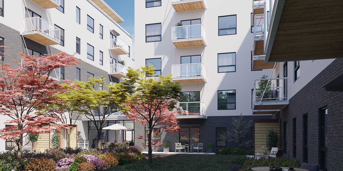 The Proxima in Esquimalt BC features a verdant courtyard with plants, grass and trees